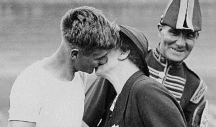 Flashback to 1938: Winner Edwin Phelps gets a kiss from his Mum.